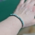Bransoletka miedziana z howlitami na nadgarstku - biżuteria handmade